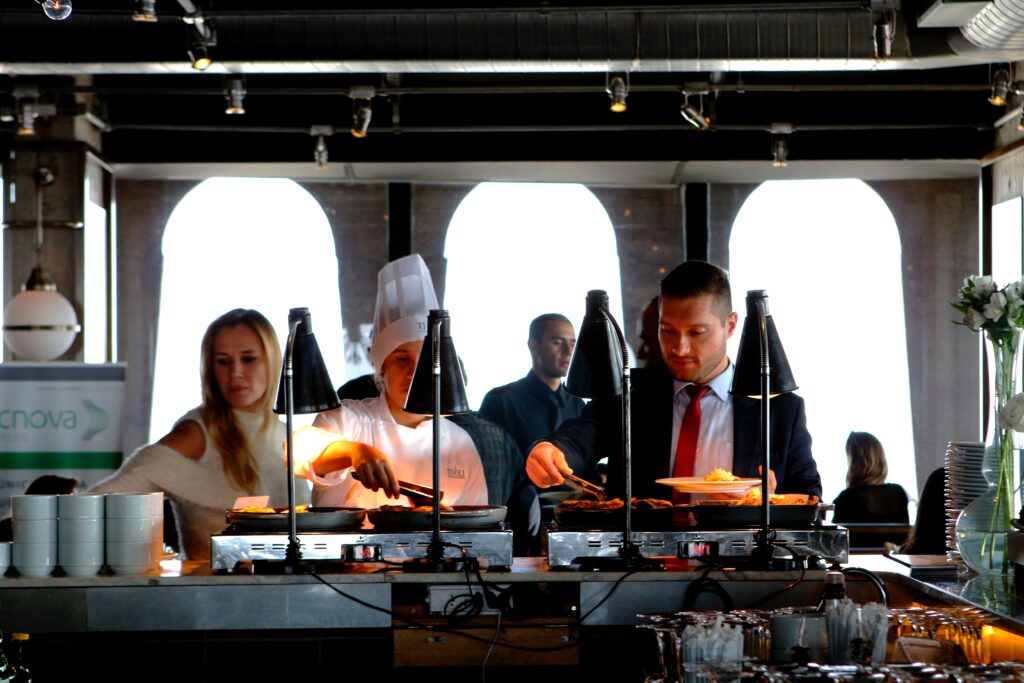 Cover Image featuring Business professionals at buffet 